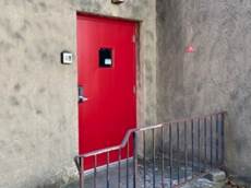 A red door on a wall

Description automatically generated with medium confidence